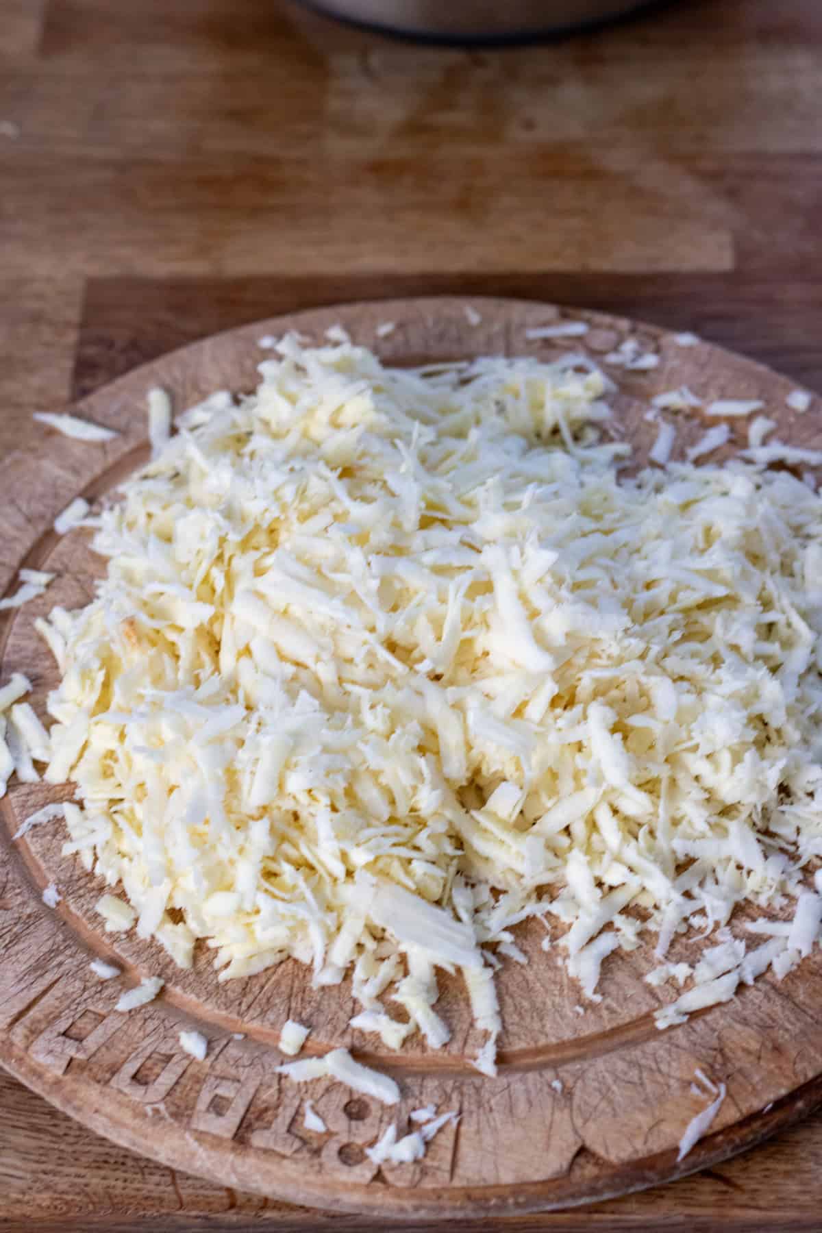 Grated parsnips on a cutting board.
