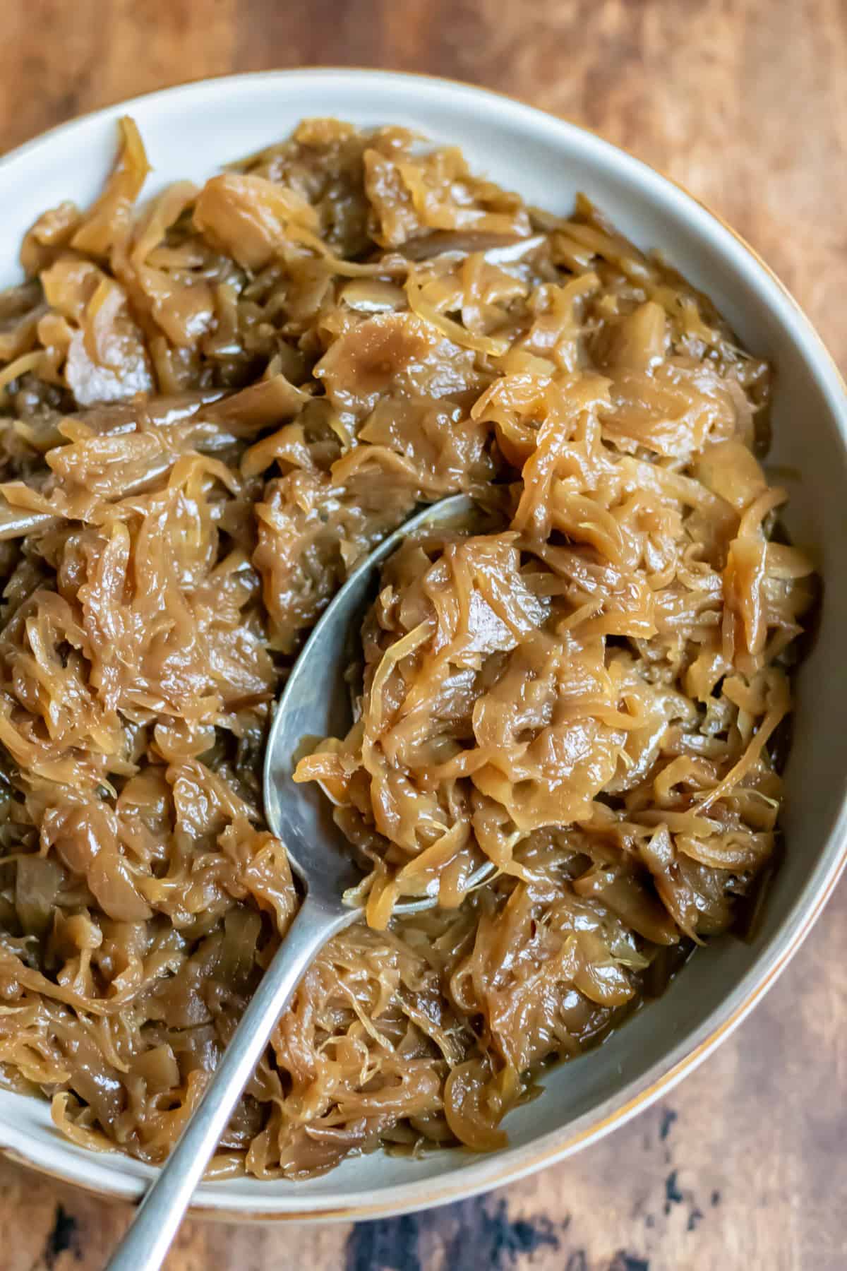Spoon in a dish of slow cooker caramelised onions.