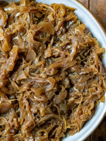 Looking down at a bowl of slow cooker caramelised onions.