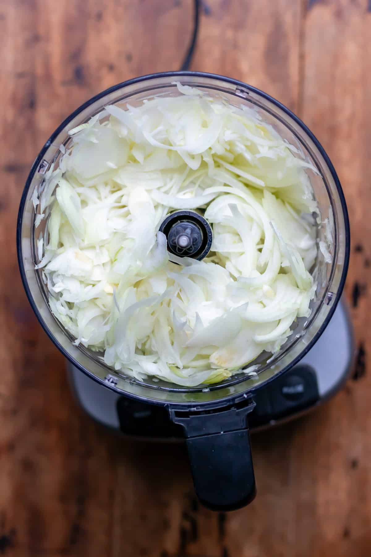 Slicing the onions in a food processor.
