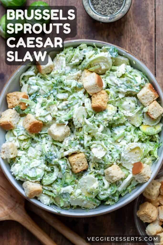 Dish of salad with text: Brussels Sprouts Caesar Slaw.