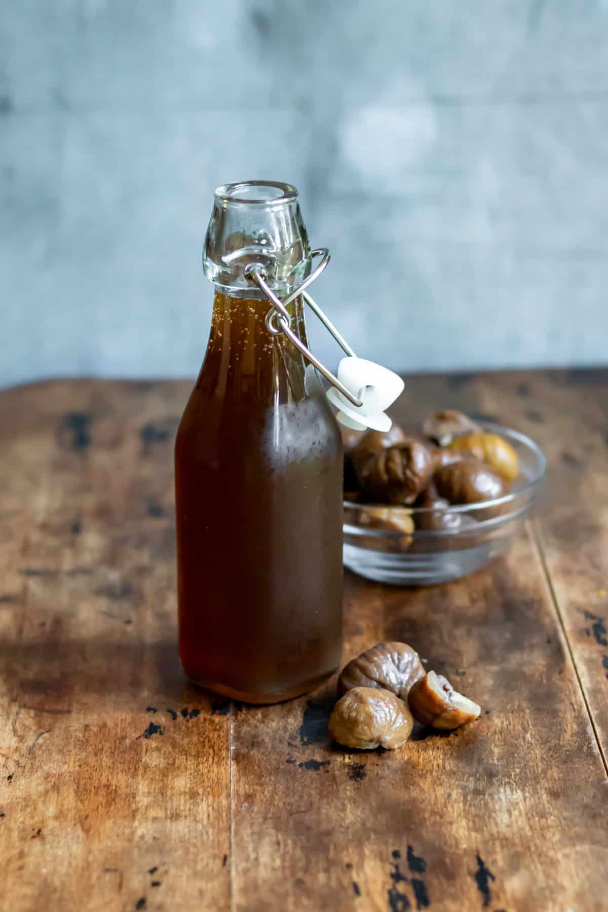Close up of a glass bottle of chestnut syrup.