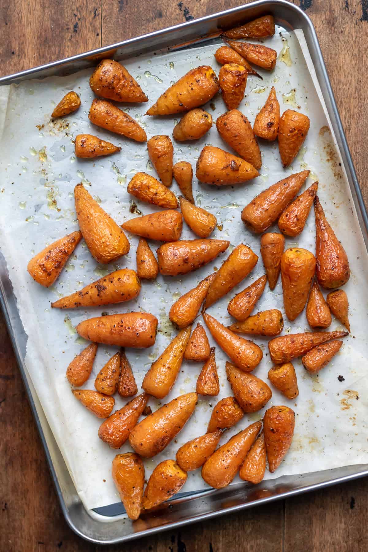 Roasted carrots on a baking sheet.