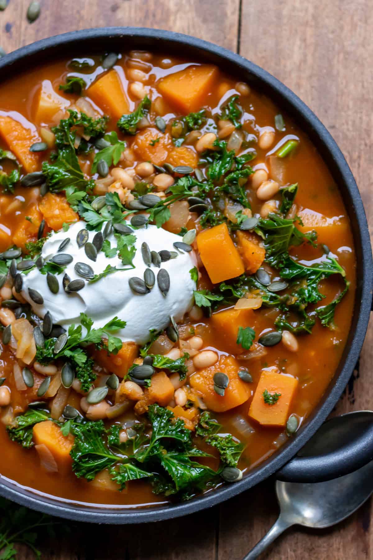 Close up of a dish of butternut squash and bean soup.