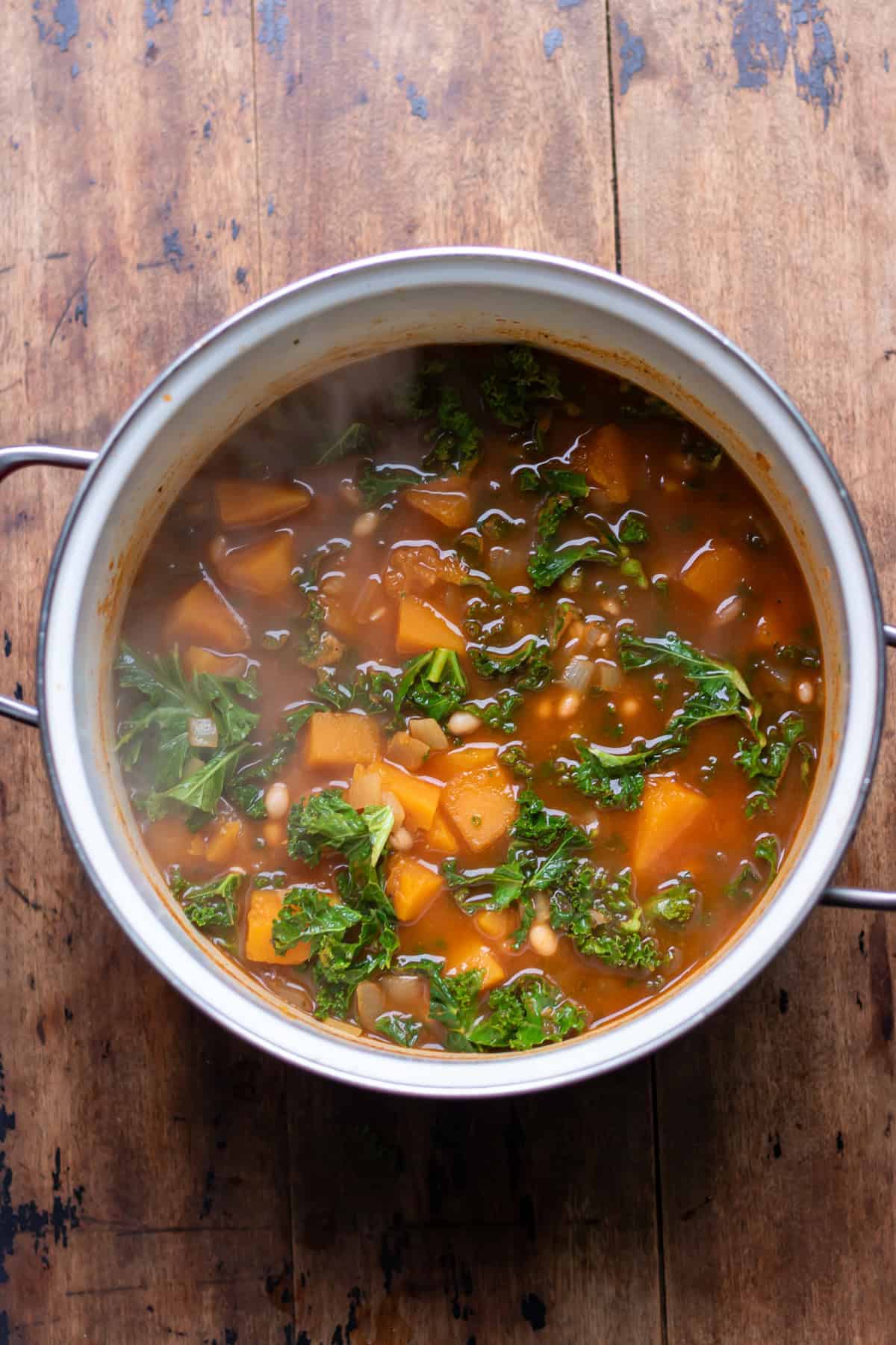 Cooked butternut squash and bean soup.