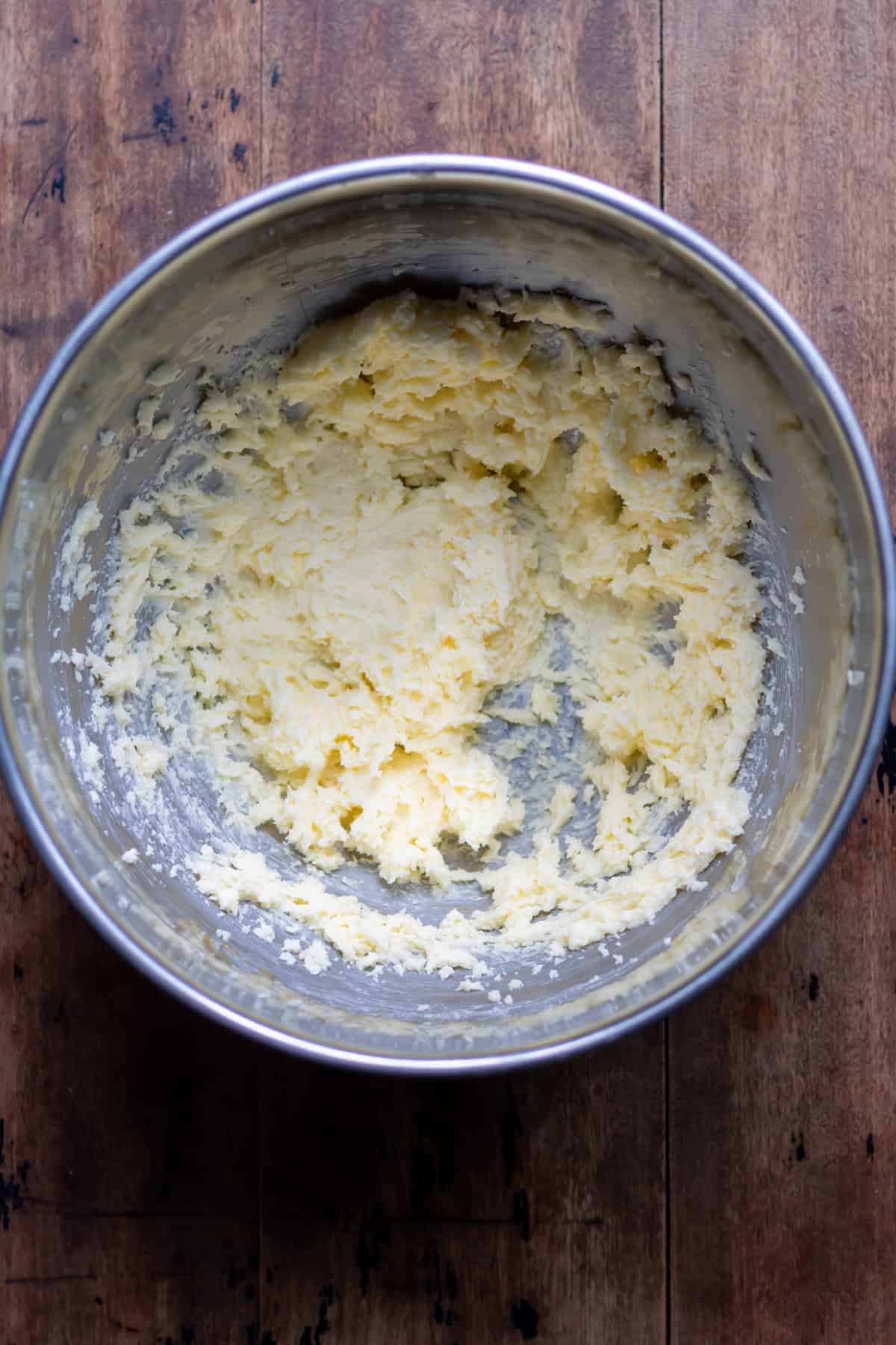 Creamed butter and sugar in a bowl.