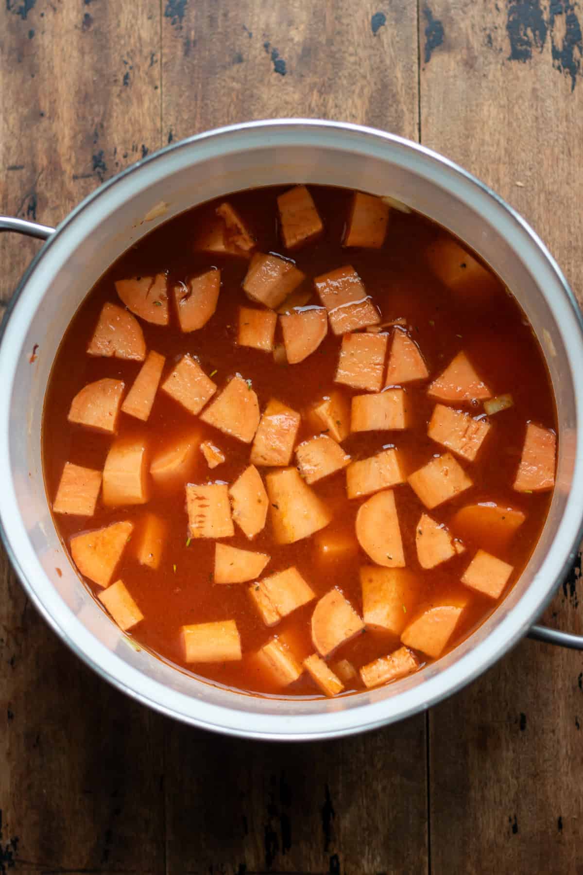 Stock and vegetables added to the pot.