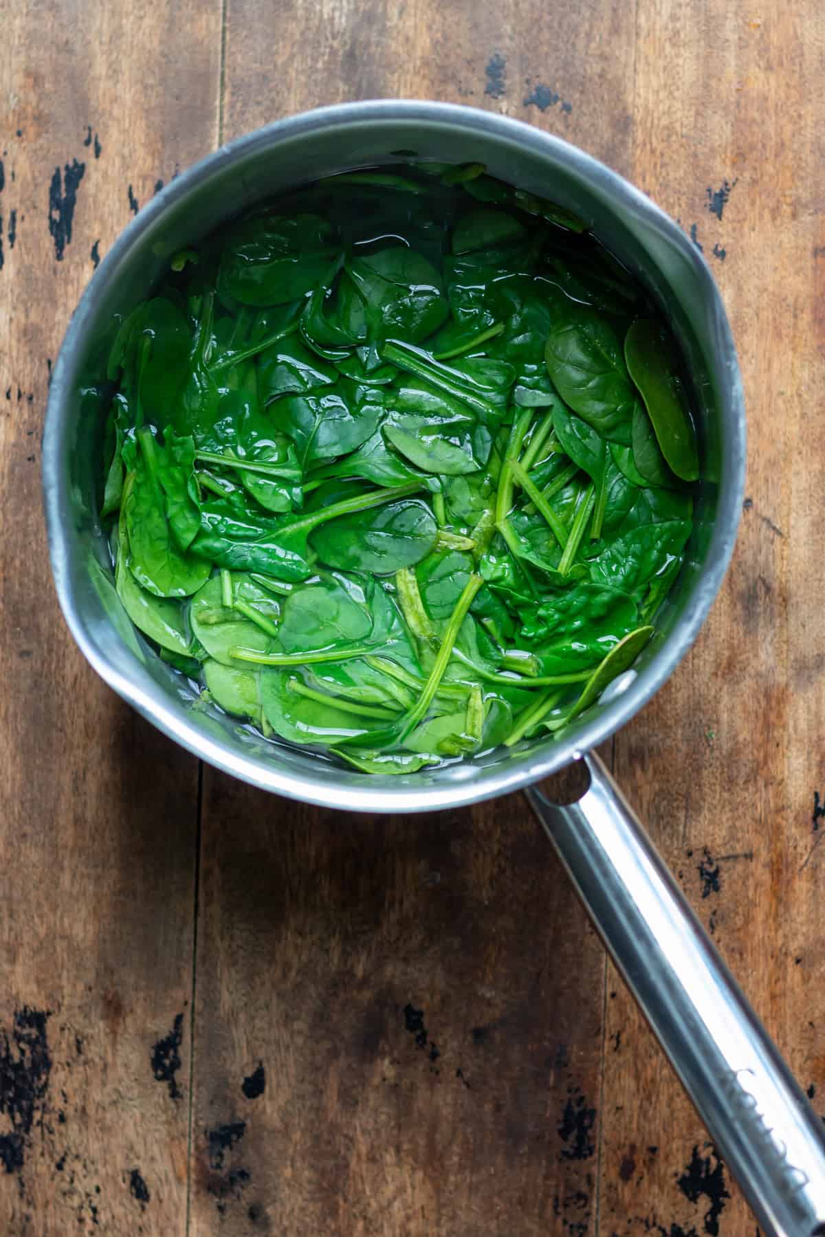 Wilted spinach in a pot.