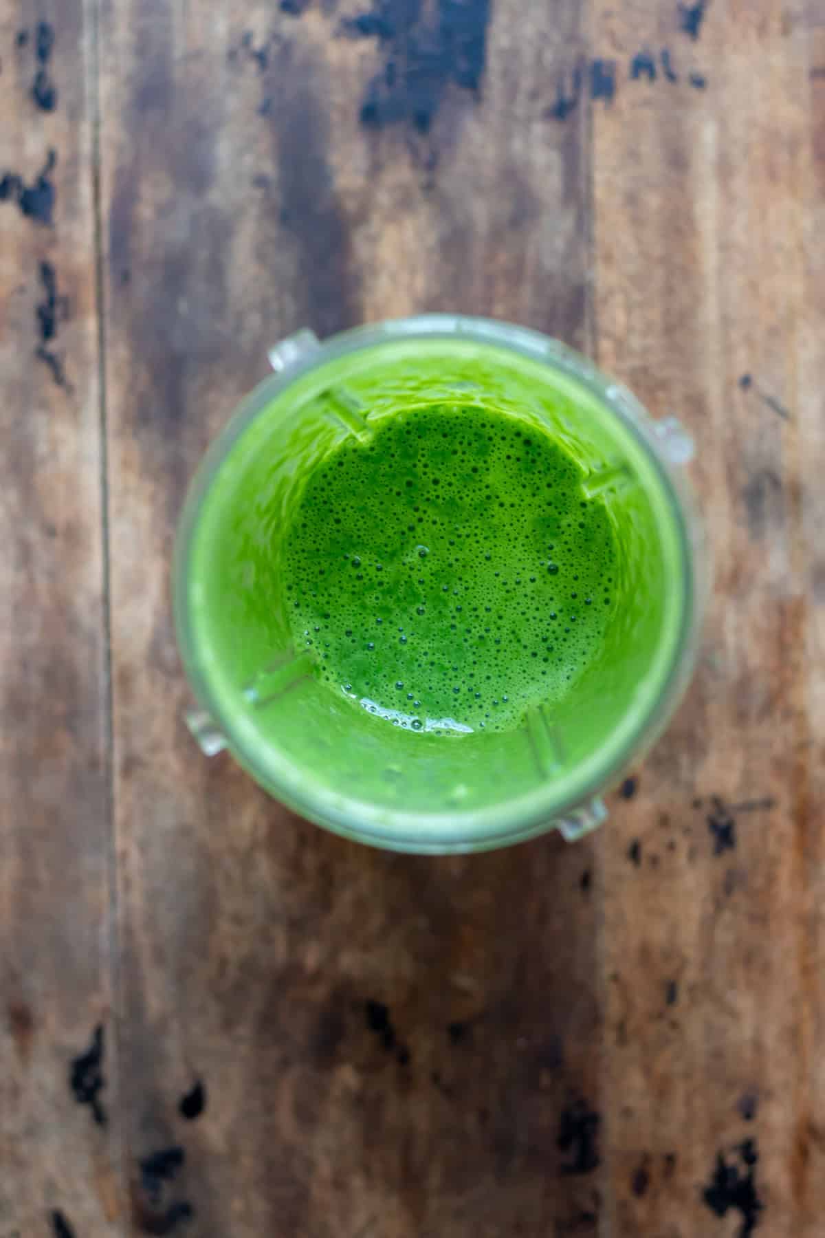 Blended spinach and eggs in a blender.