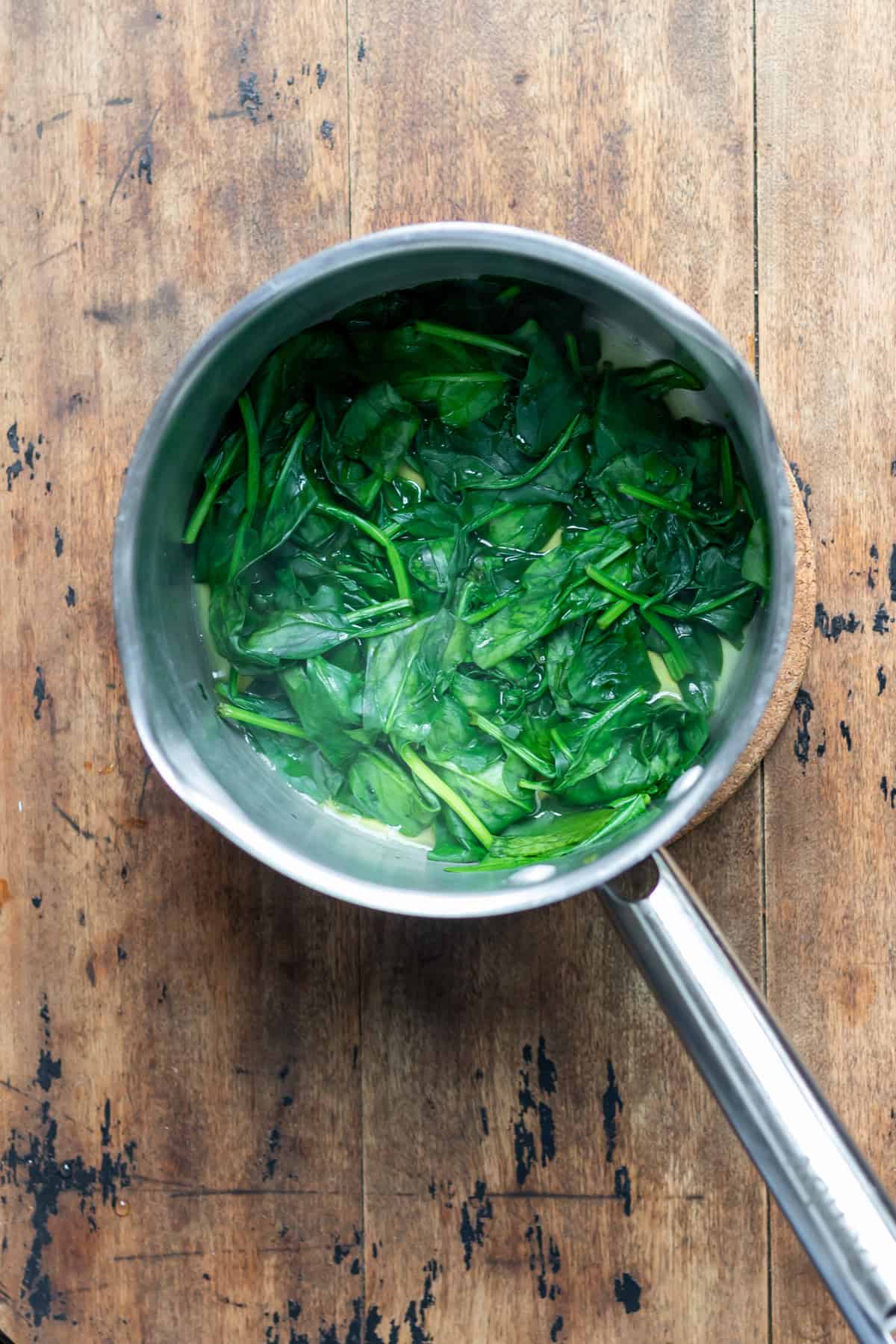 Wilted spinach in a pot.