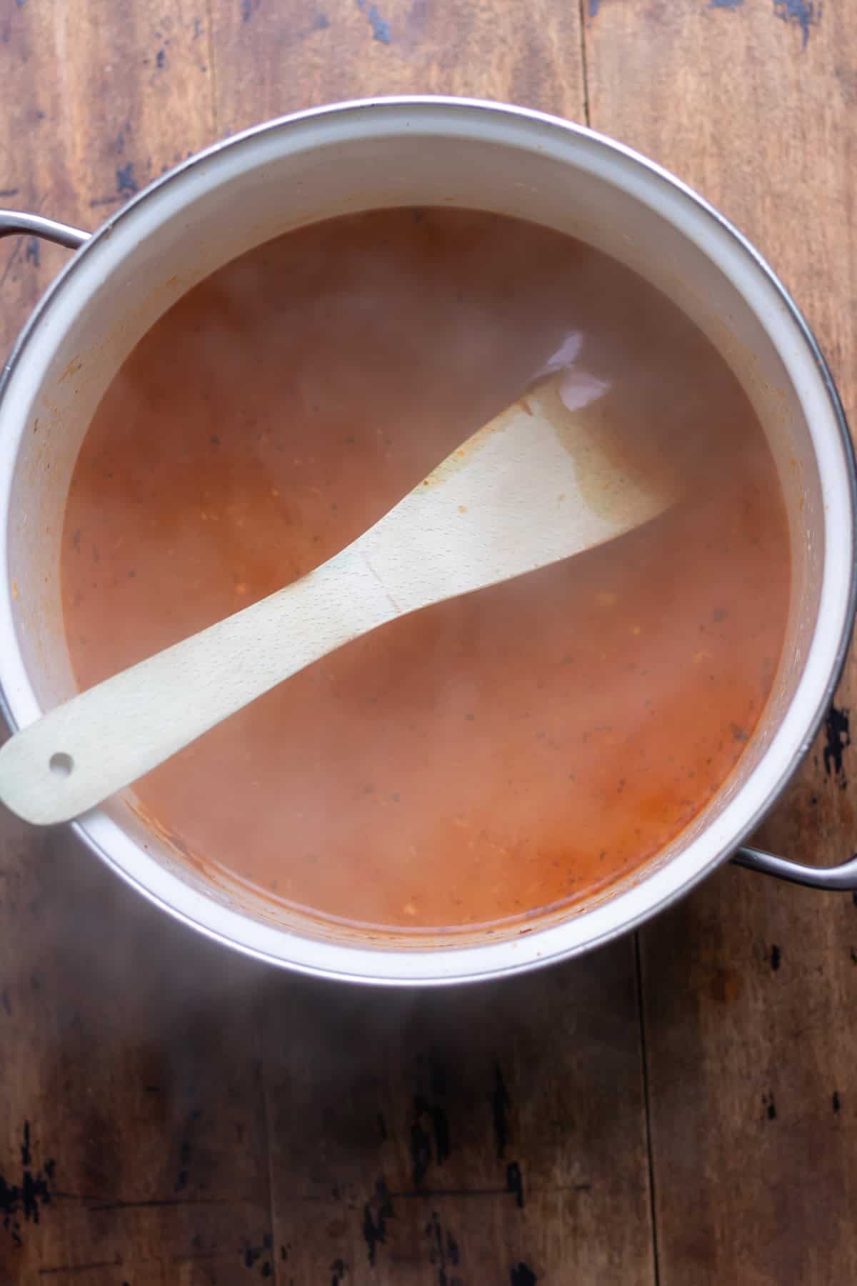 Broth added to the soup.