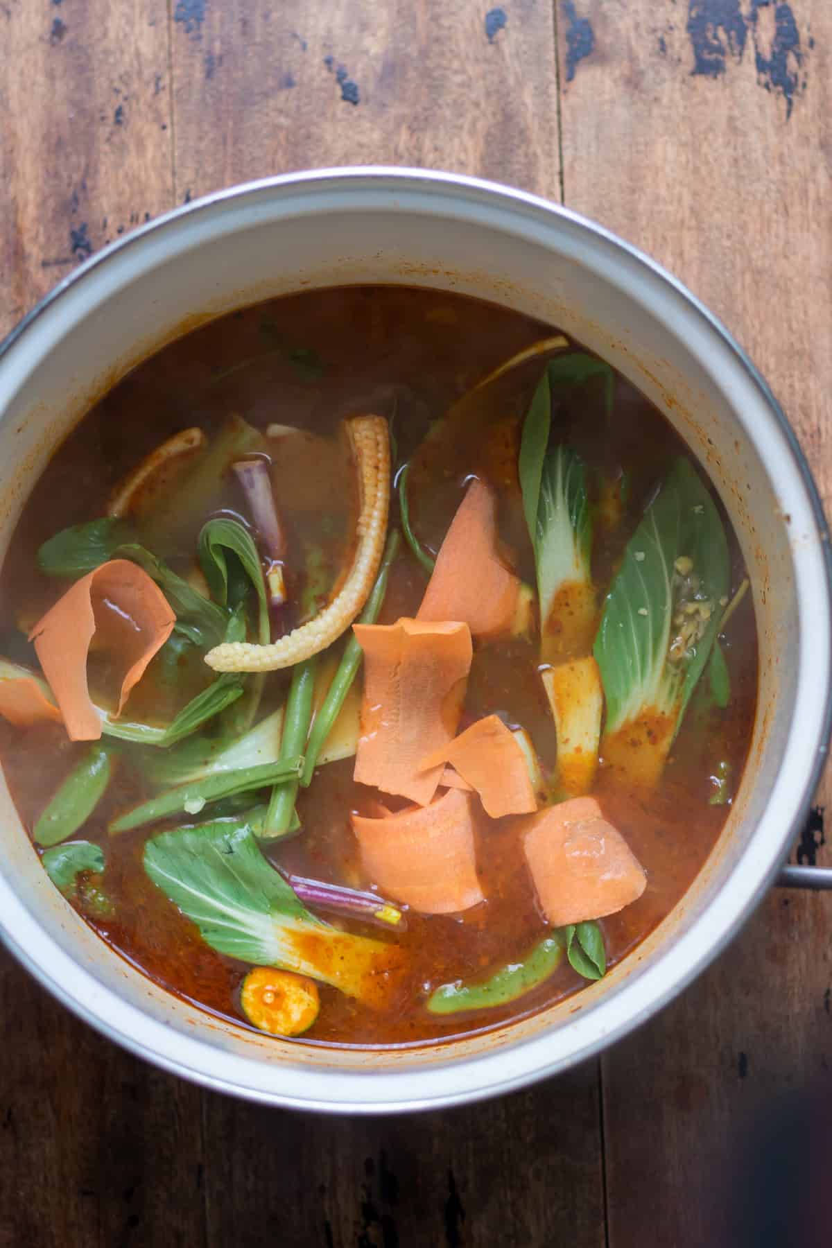 Stir fry vegetables added to the soup pot.