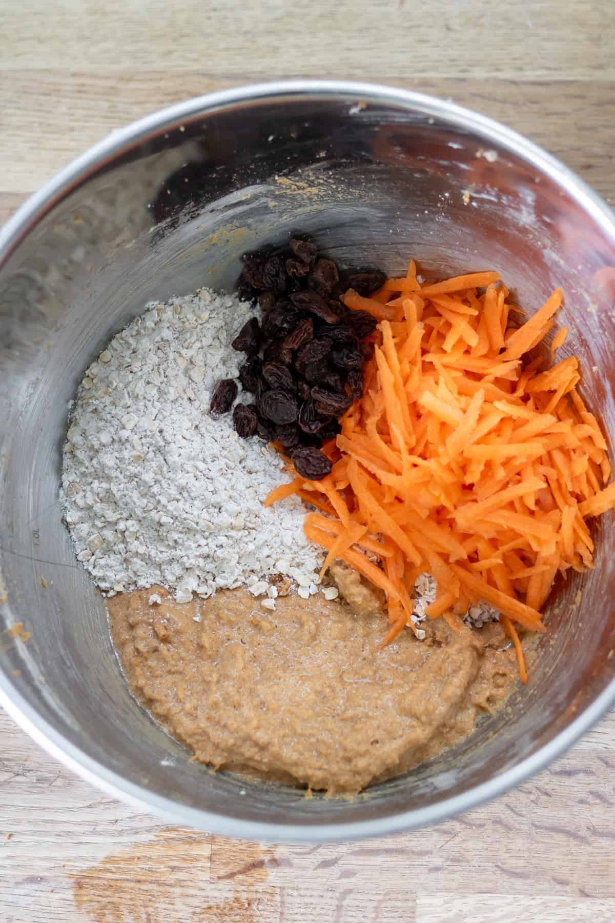 Dry ingredients, shredded carrot and raisins added to the wet mixture.