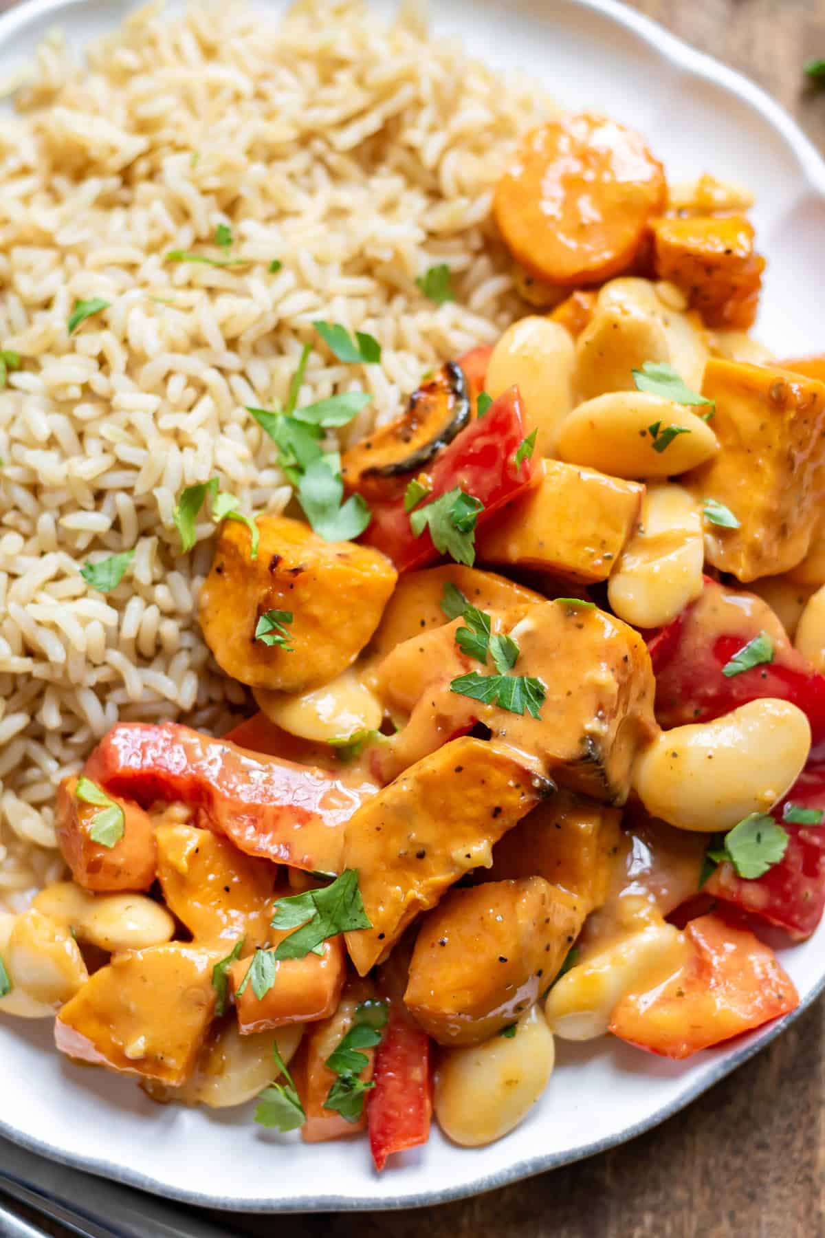 Close up of a plate of rice and Sweet Potato Thai Red Curry.
