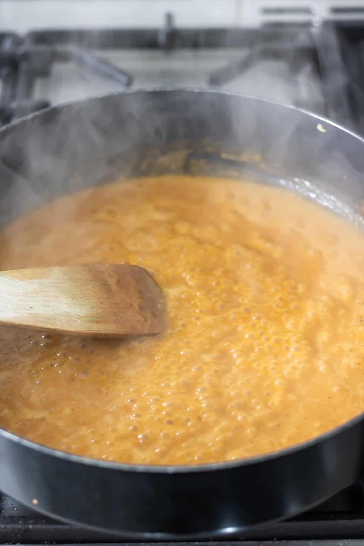 Simmering thai red curry sauce.