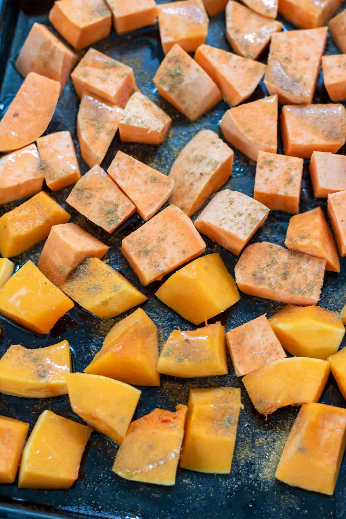 Vegetables drizzled with olive oil and sprinkled with ground cumin.