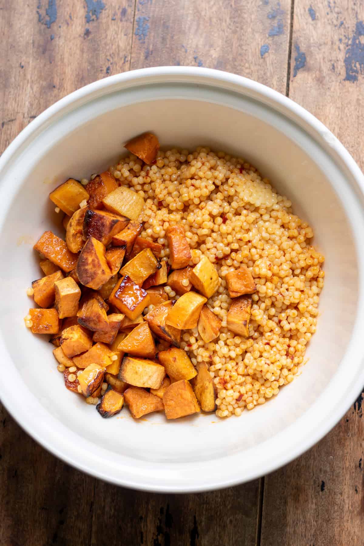 Roasted vegetables added to the harissa giant pearl couscous.