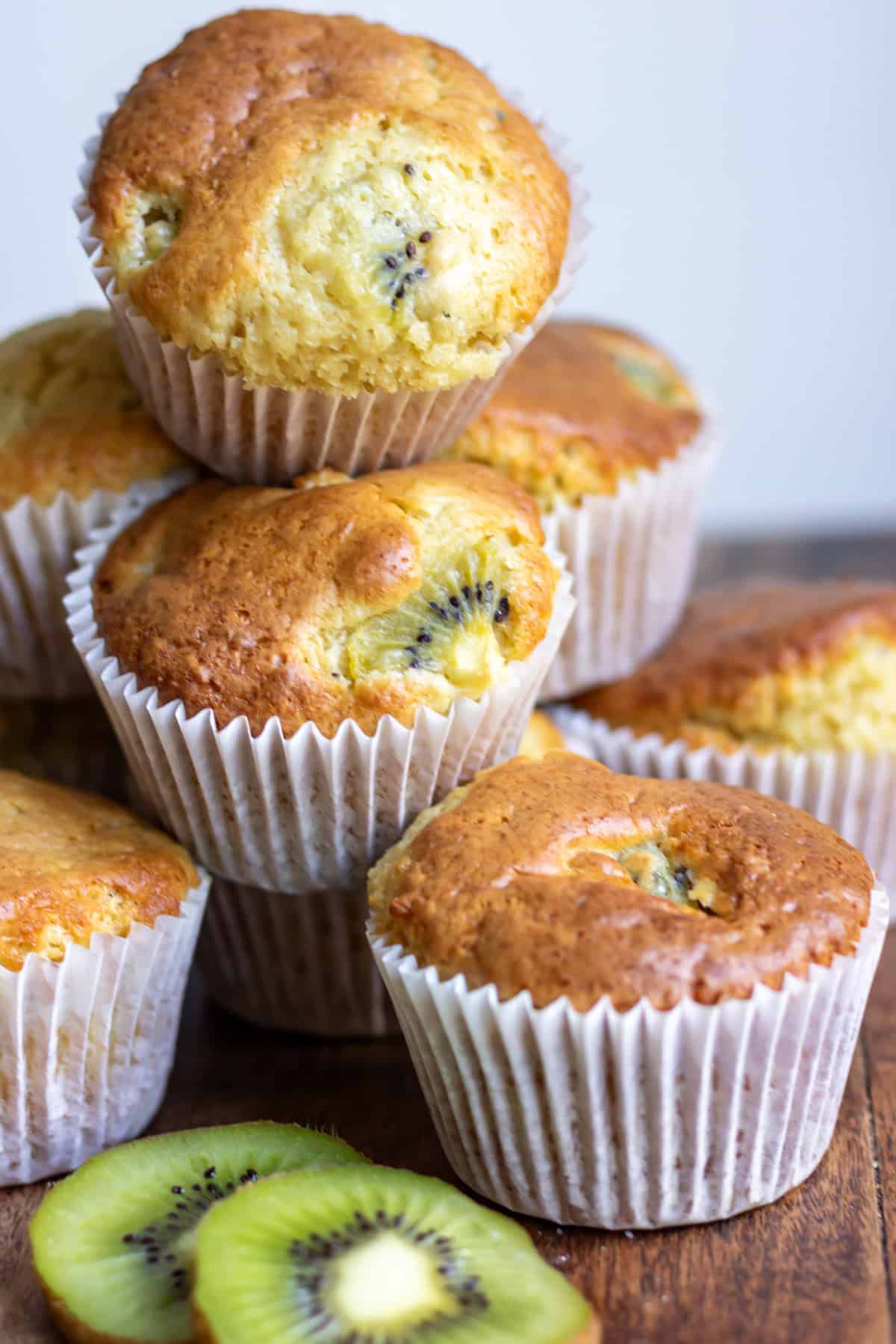 Closeup of a stack of kiwi muffins.