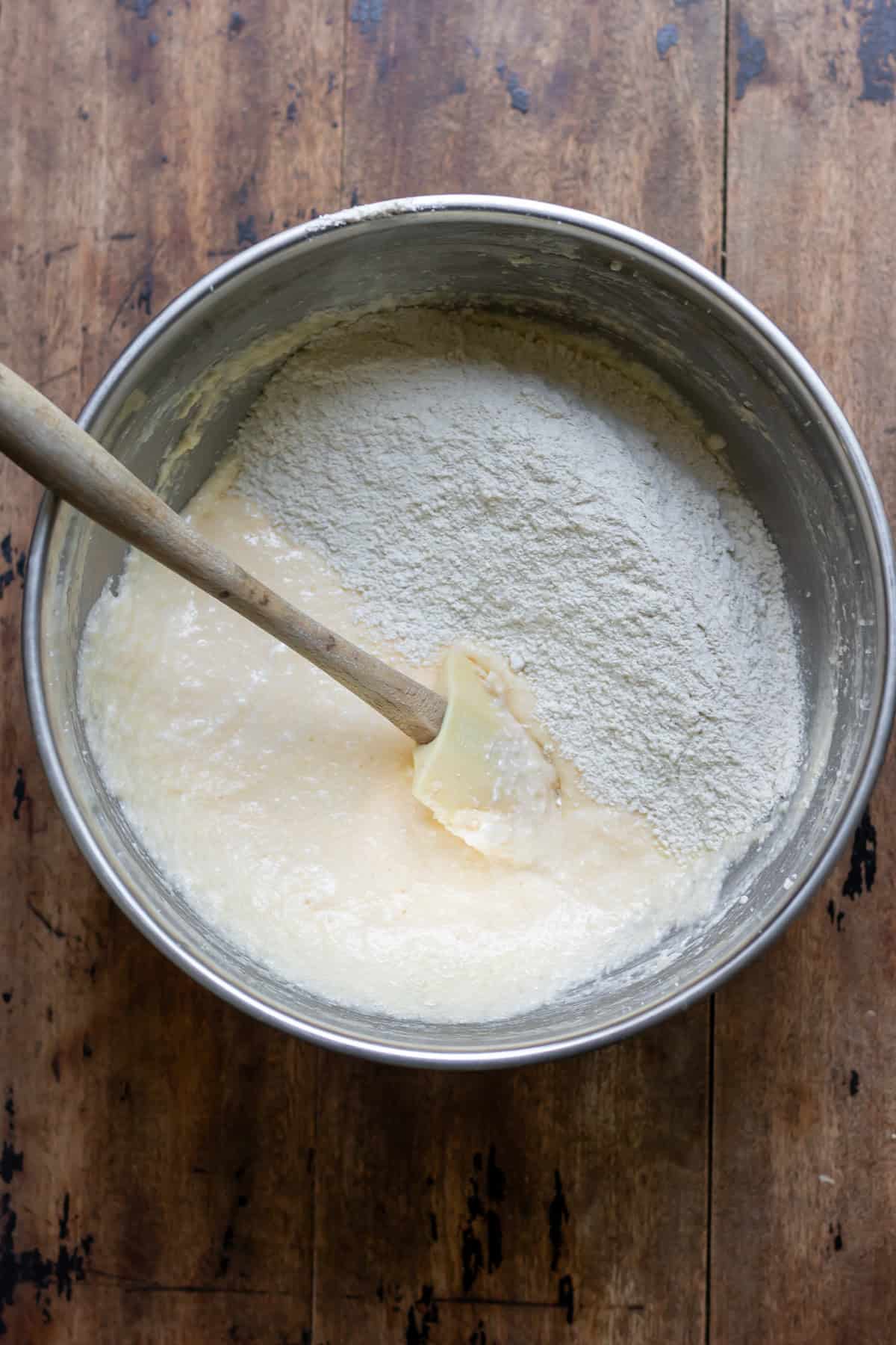 Mixing the dry ingredients into the wet.