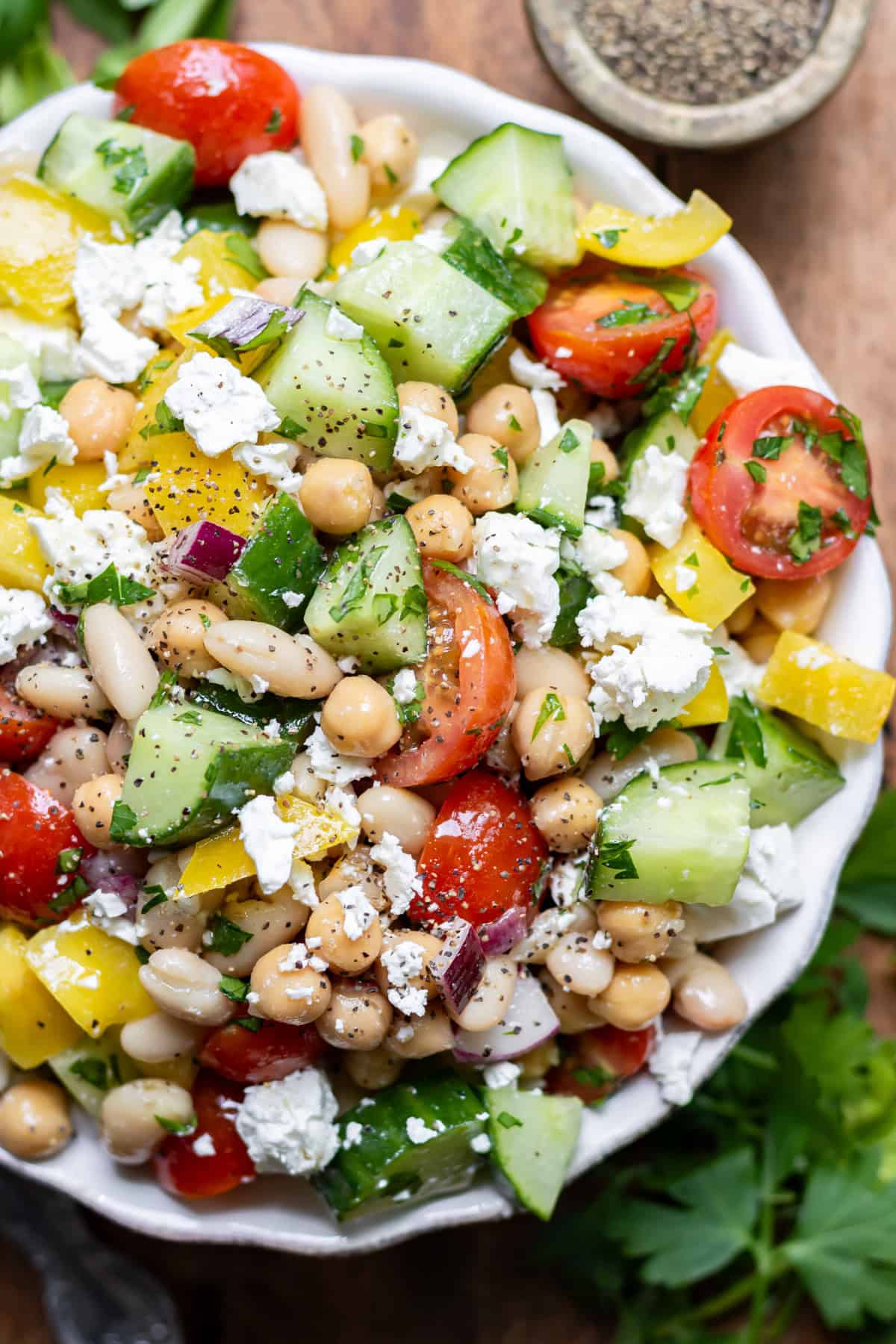 Close up of Mediterranean Bean Salad in a serving bowl.