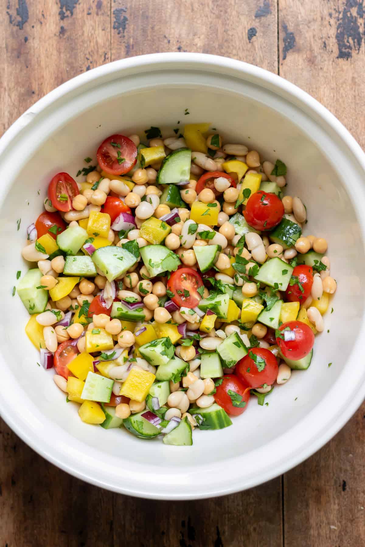 Veggies tossed with the beans in the mixing bowl.