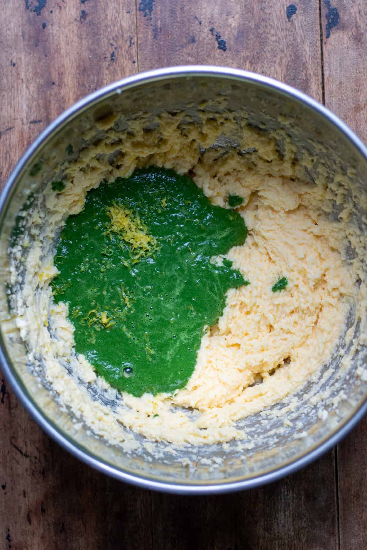 Stinging nettle puree added to the bowl.