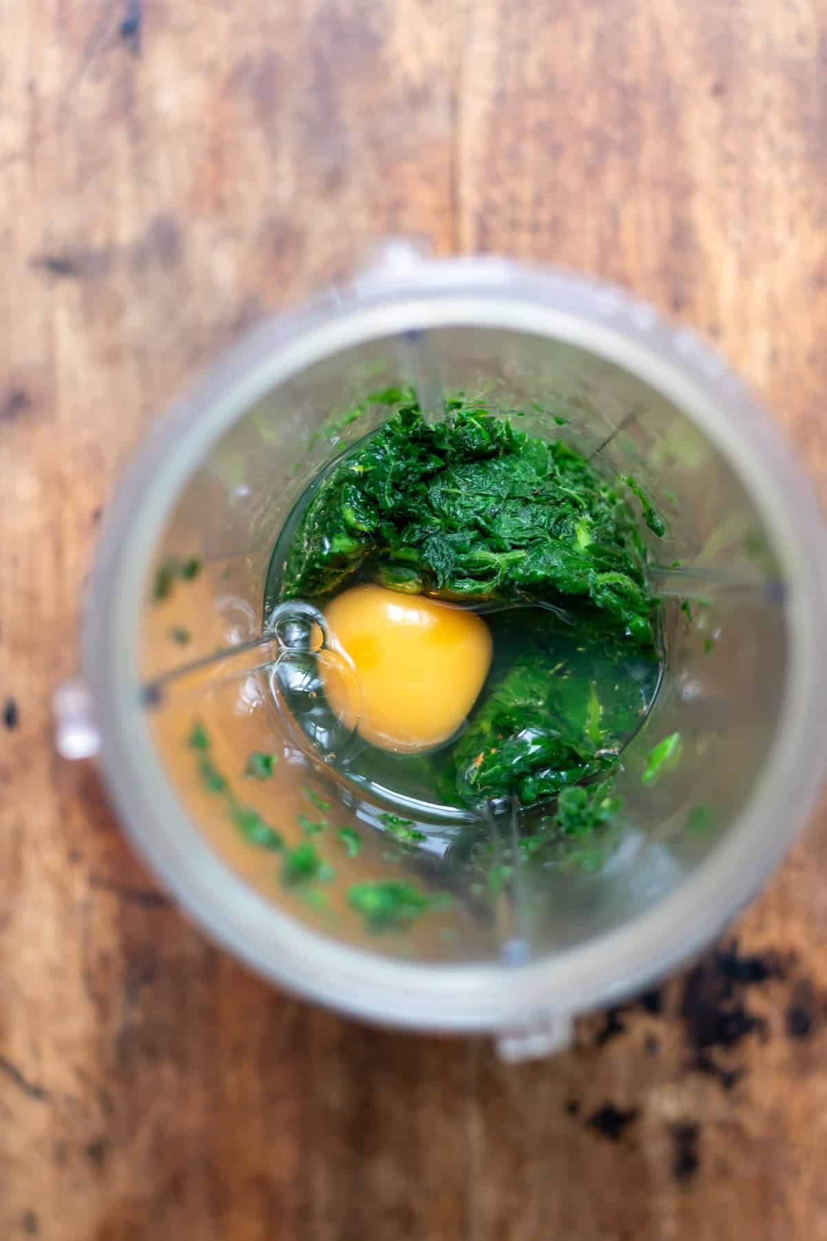 Stinging nettles in a blender with an egg, vanilla and lemon juice.
