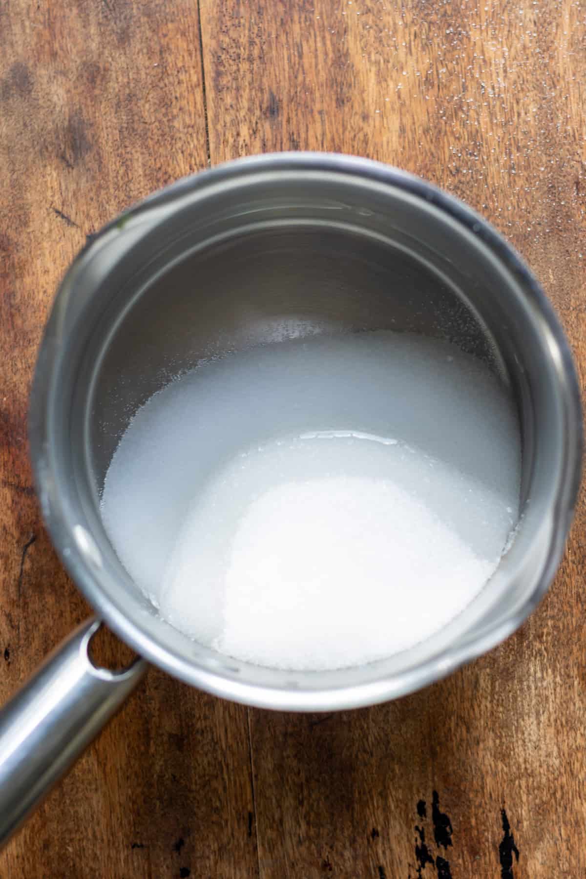 Sugar and water in a saucepan.