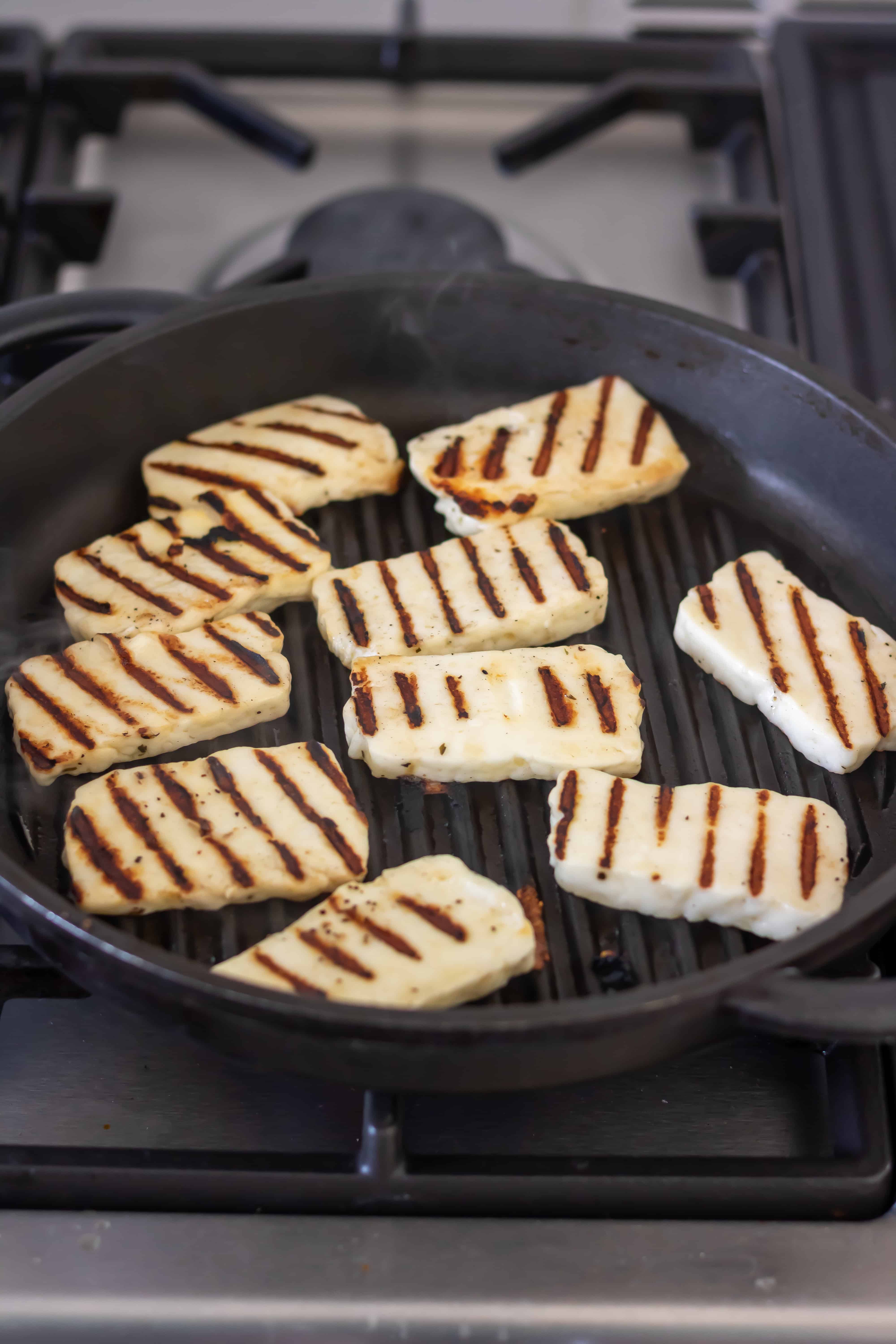 Cooking halloumi on a grill pan.