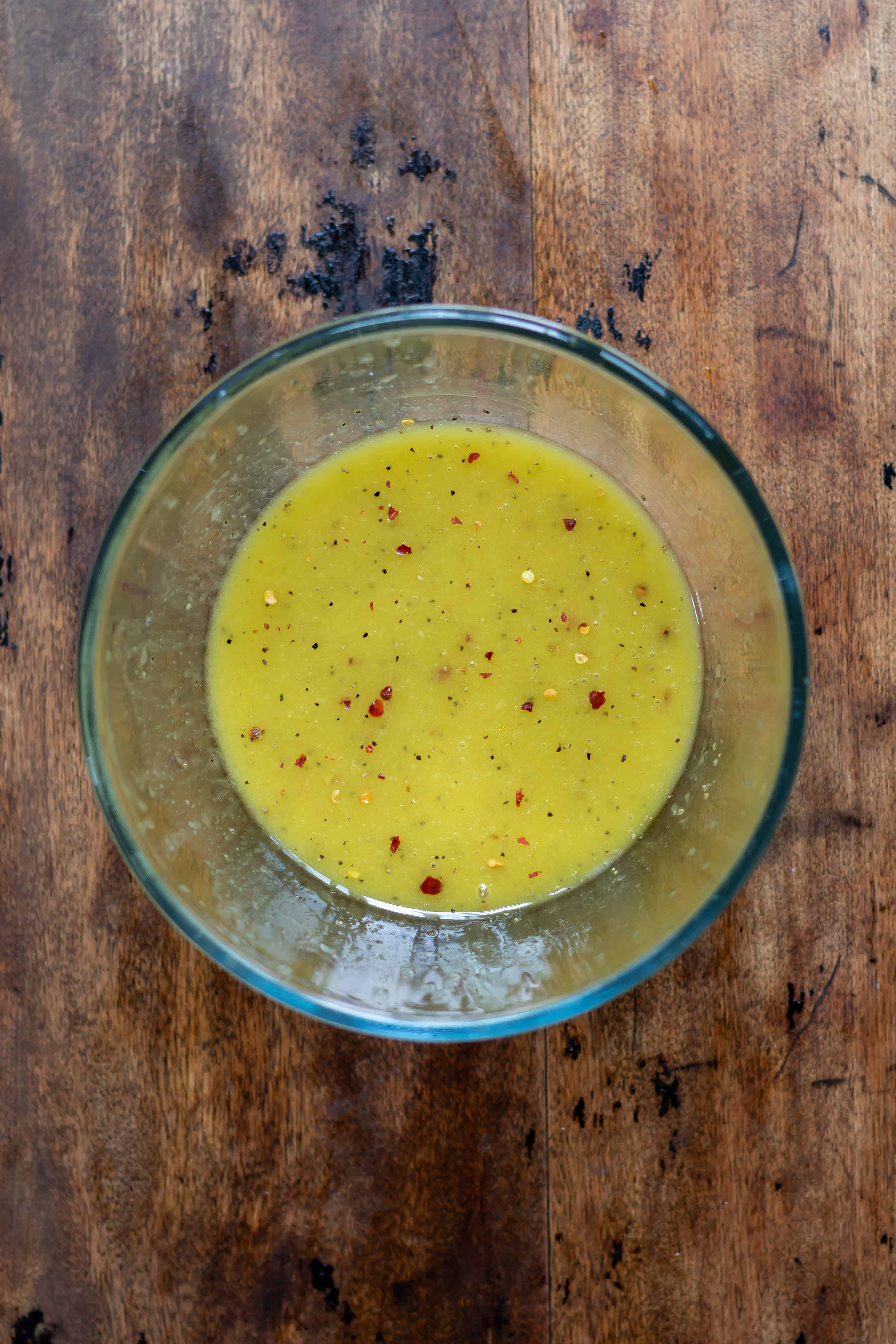 Bowl of hot honey vinaigrette.