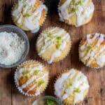 Looking down at lime coconut muffins drizzled with lime glaze.