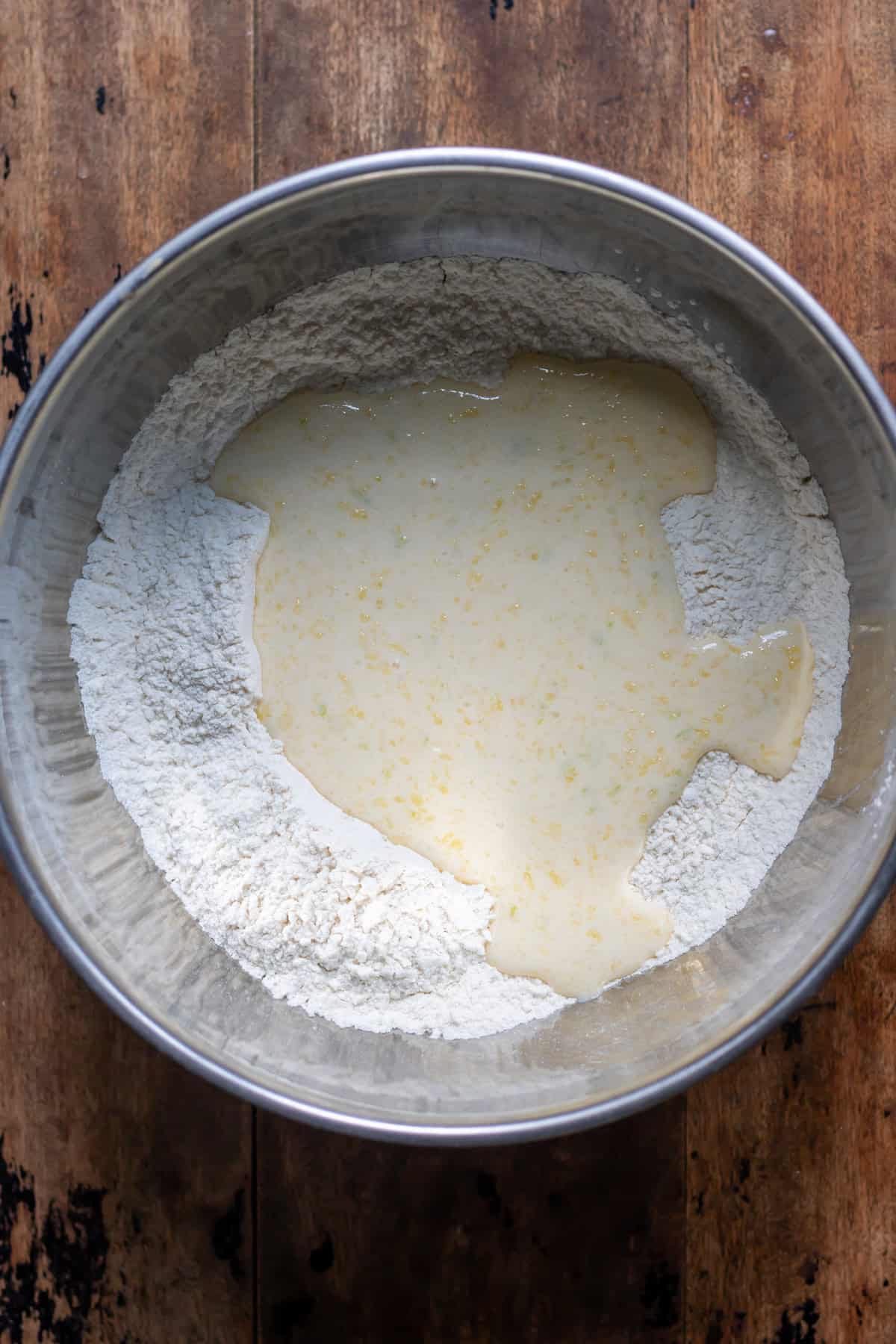 Adding the wet ingredients to the dry ingredients.