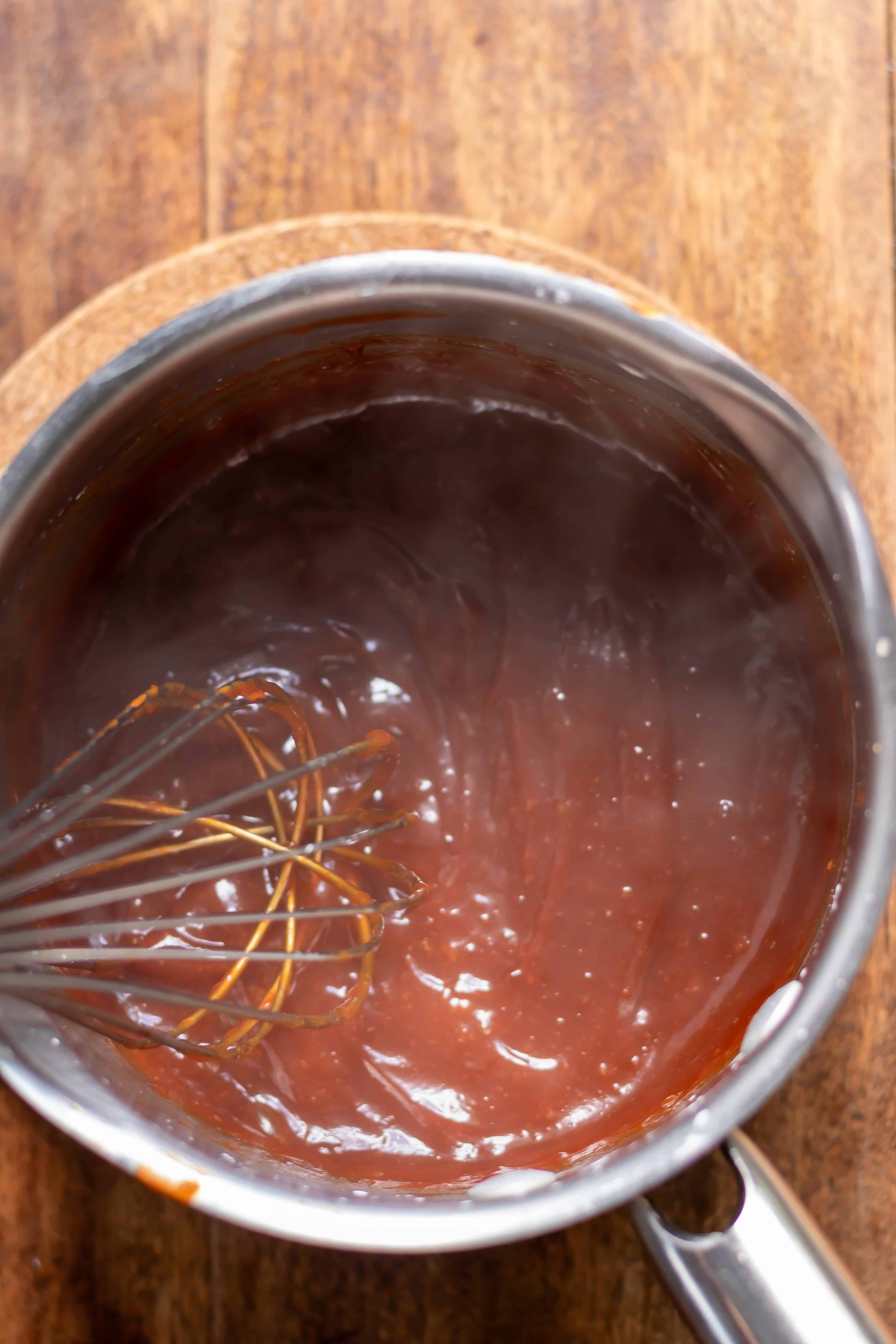 Whisking the gochujang sauce.