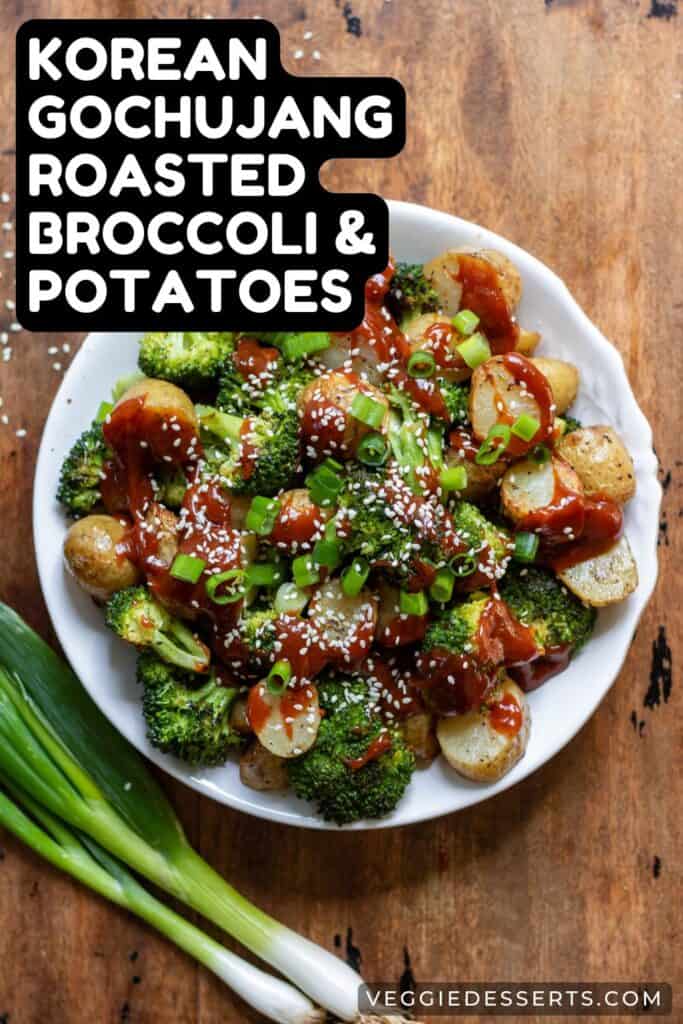 Side dish of potatoes, with text: Korean Gochujang Roasted Broccoli and Potatoes.