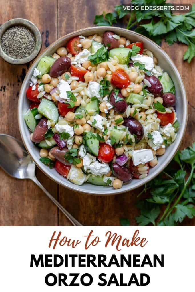 Bowl of salad on a table, with text: How to Make Mediterranean Orzo Salad.