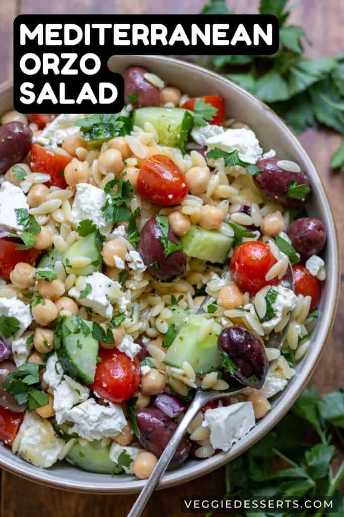 Dish of salad with text: Mediterranean Orzo Salad.