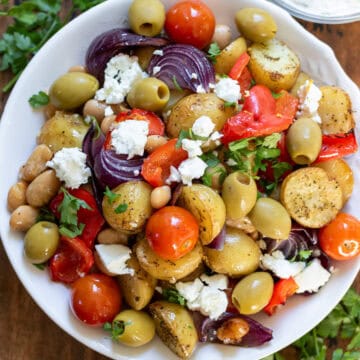 Greek Butter Bean Tray Bake with Potatoes and Feta in a serving dish.