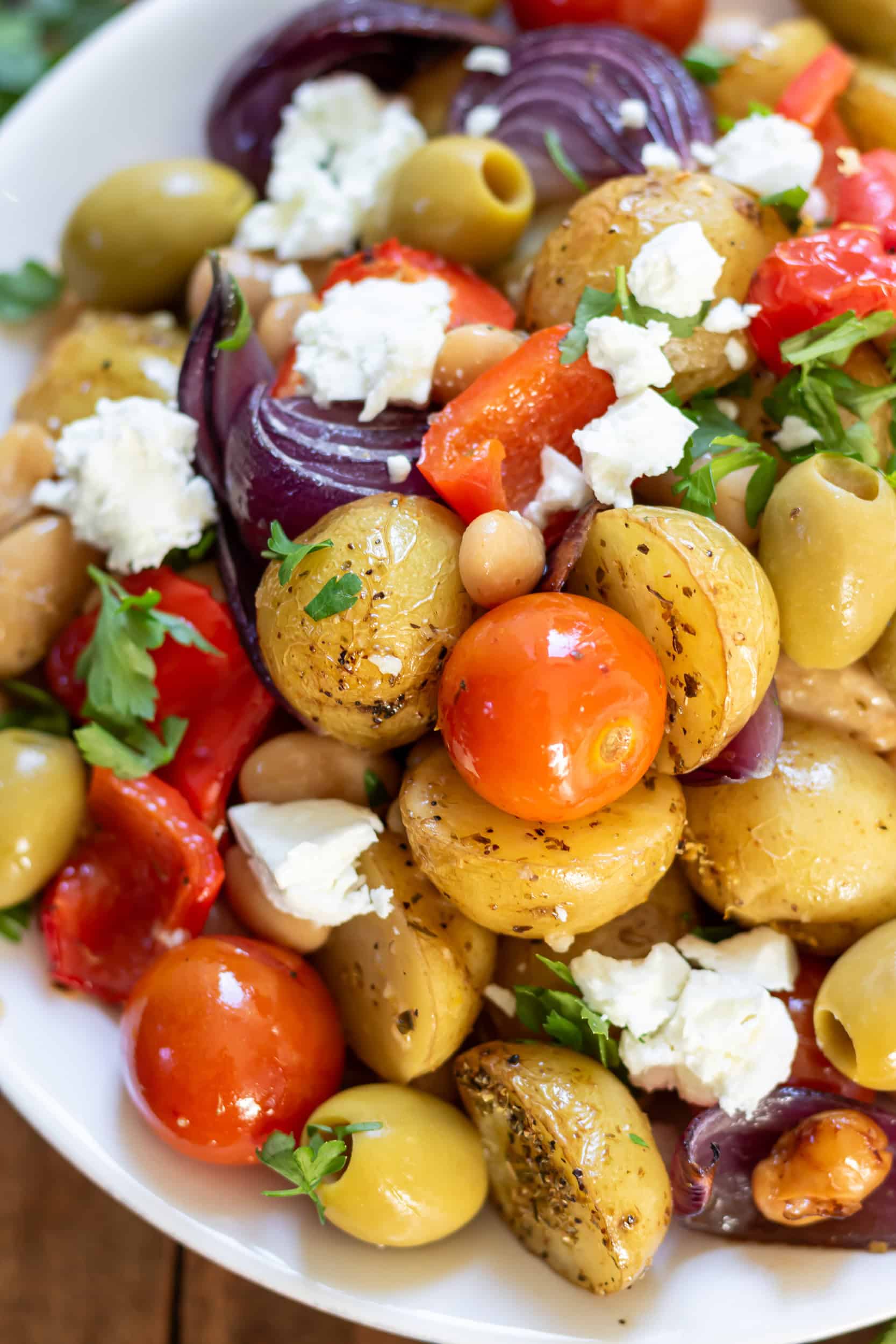 Close up of a dish of Greek lemon butter beans and potatoes.