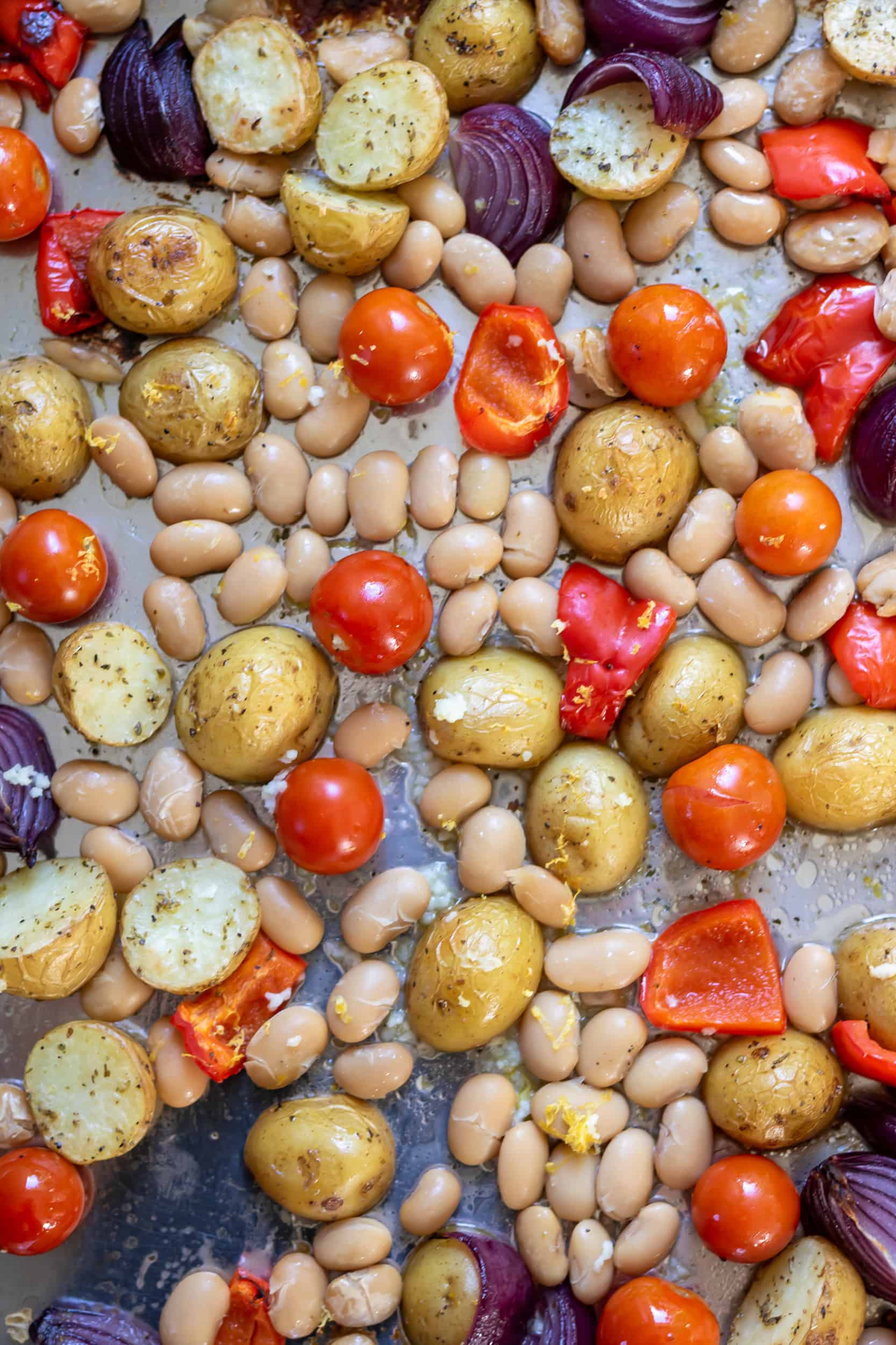 Partially roasted potatoes, butter beans, tomatoes, red peppers and onions.
