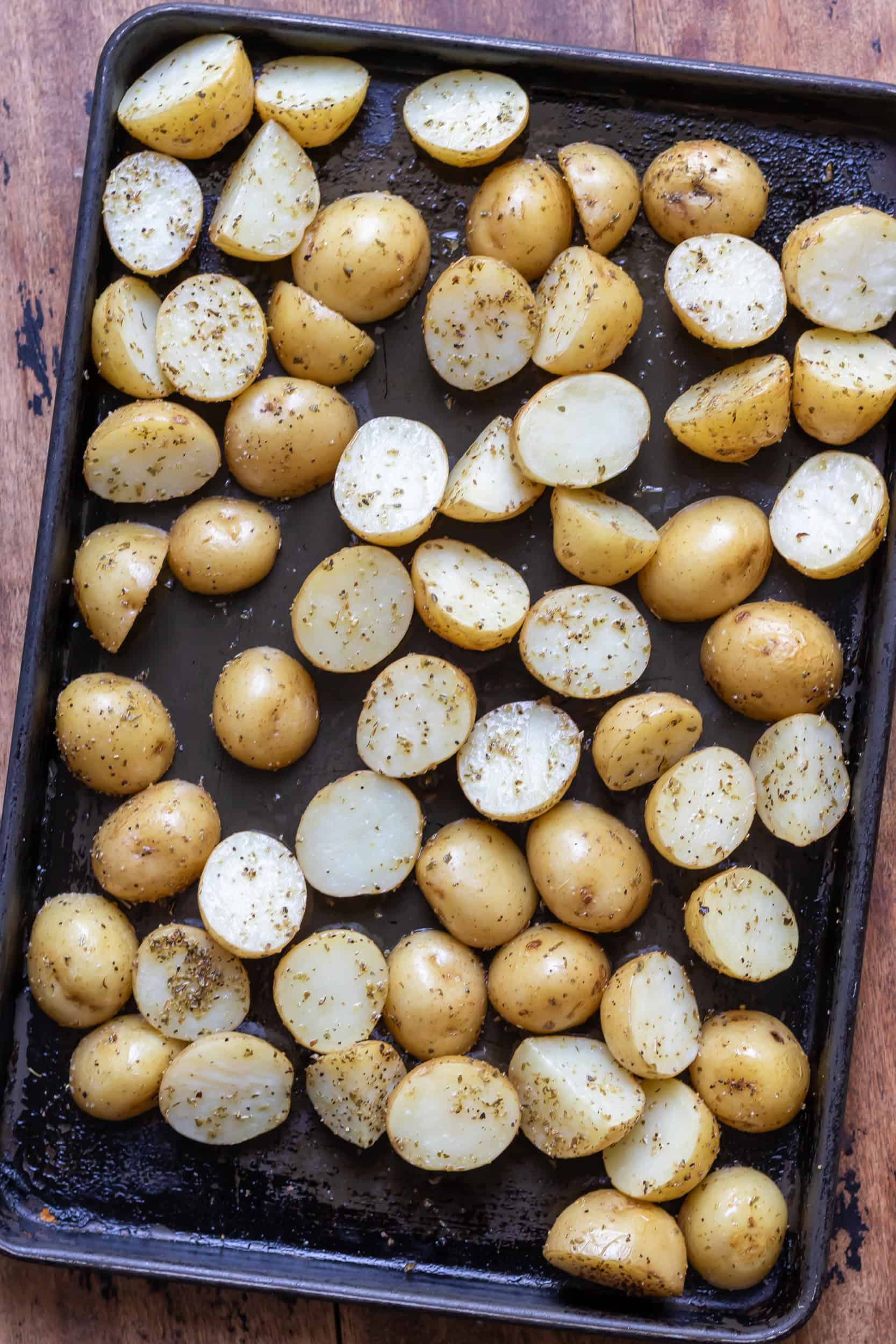 Partially roasted Greek baby potatoes.
