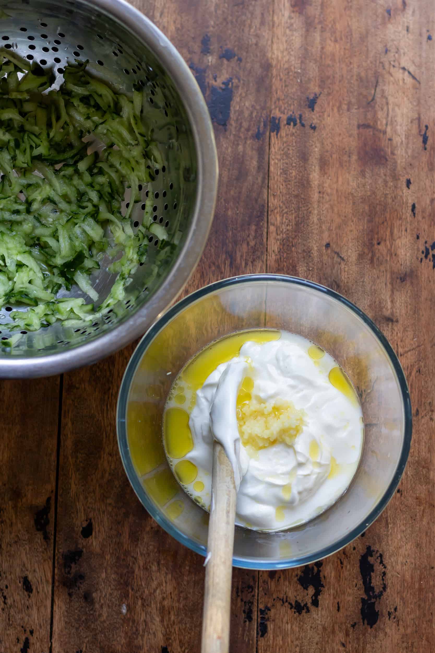Bowl of yogurt with oil, lemon juice and olive oil.