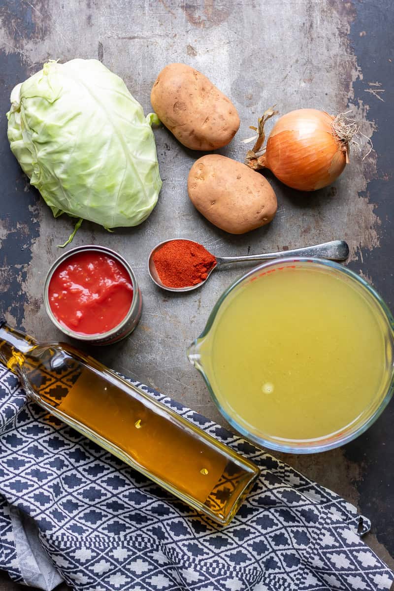 Ingredients for healthy cabbage soup on a table.