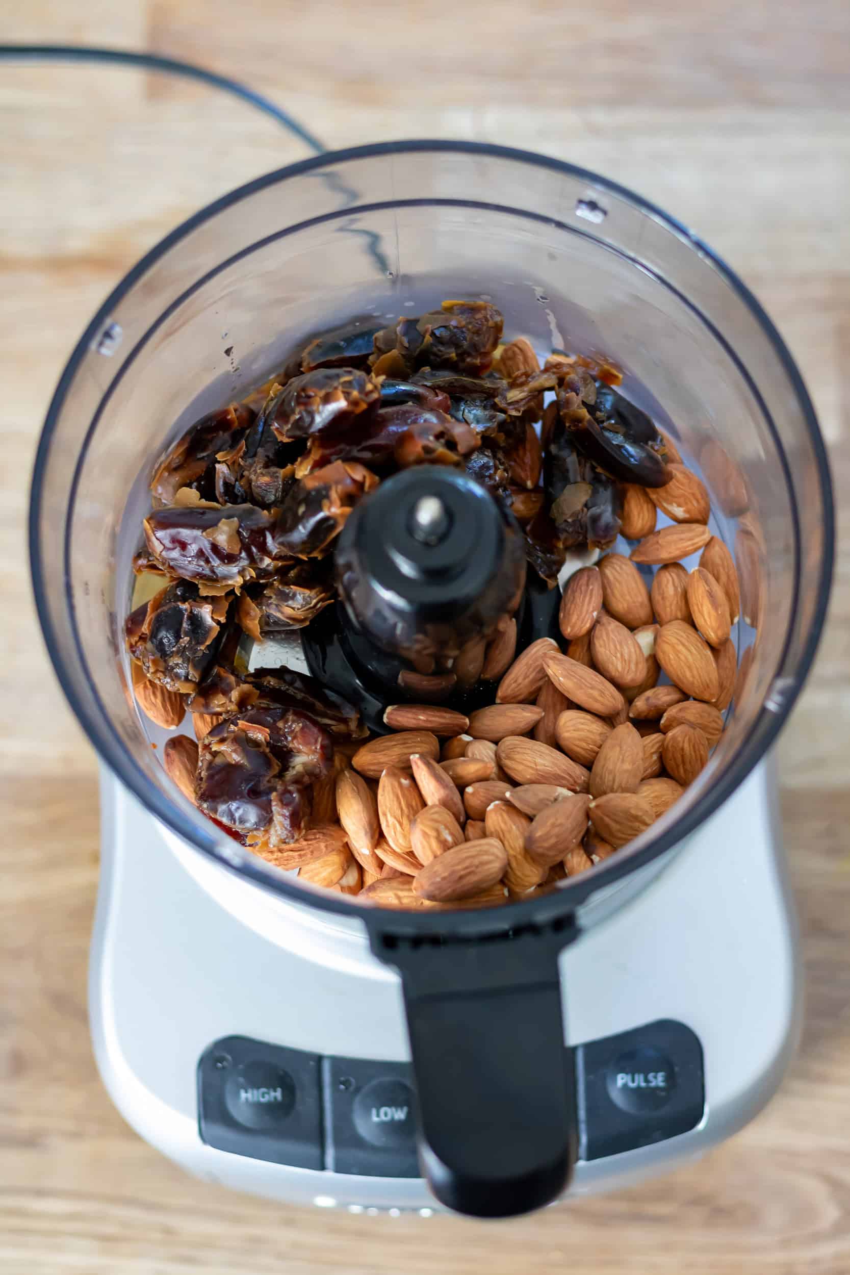 Dates and almonds in a food processor.