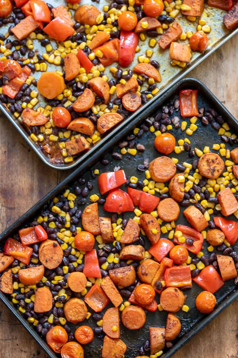 Two trays of roasted mexican chipotle vegetables.