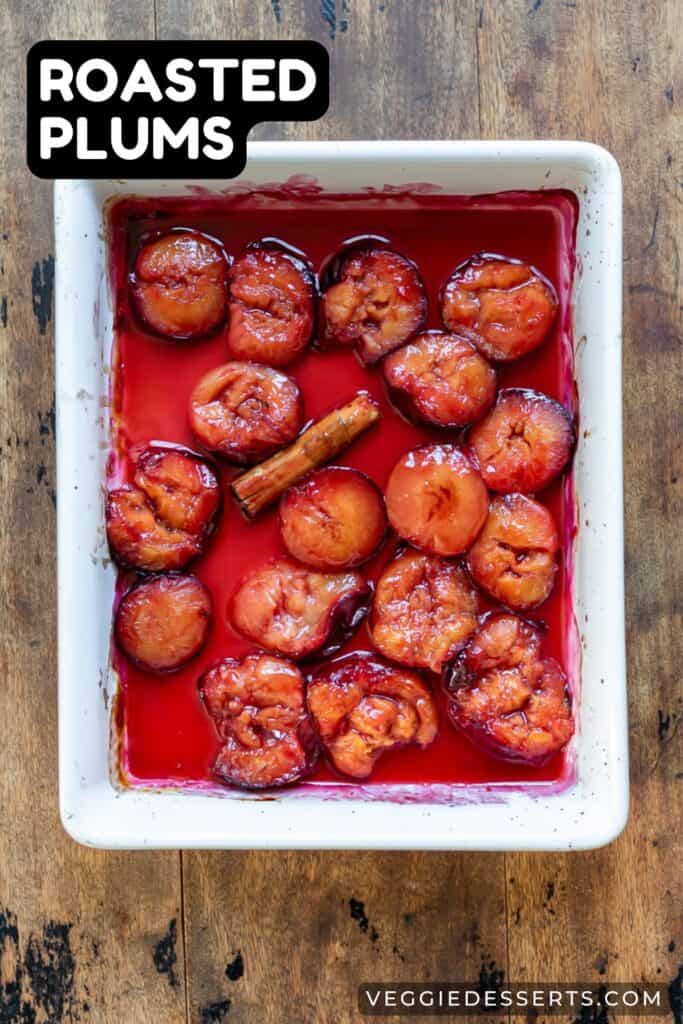 A dish of baked plums with text: Roasted Plums.