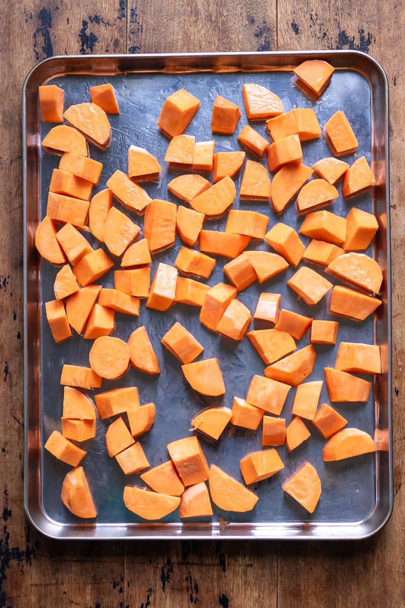 Sweet potatoes on a roasting tray.