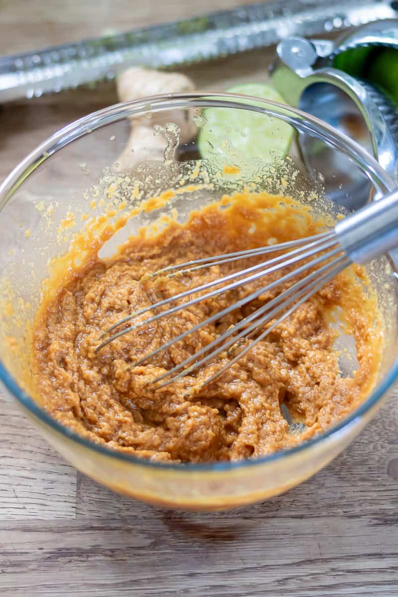 Whisking the peanut lime sauce.