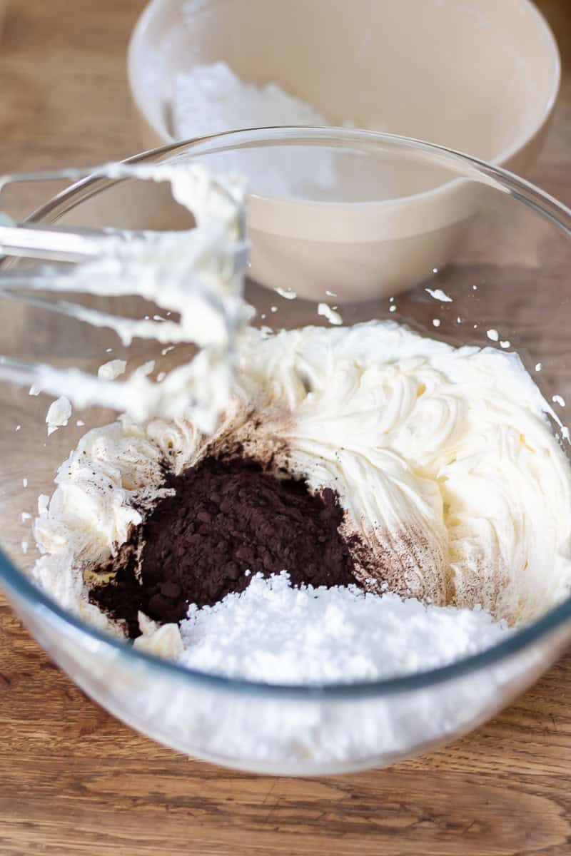 Icing sugar and black cocoa added to the beaten cream cheese.